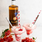 Two Italian Soda Ice Cream Floats With a Bottle of Malabar Spiced Liqueur